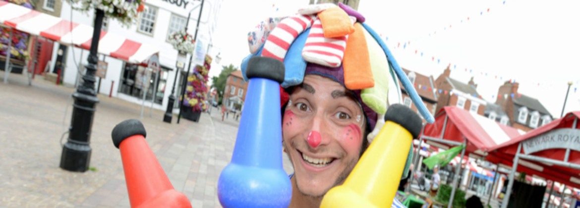 A juggler in the Market Place for our Family Play Day in 2021