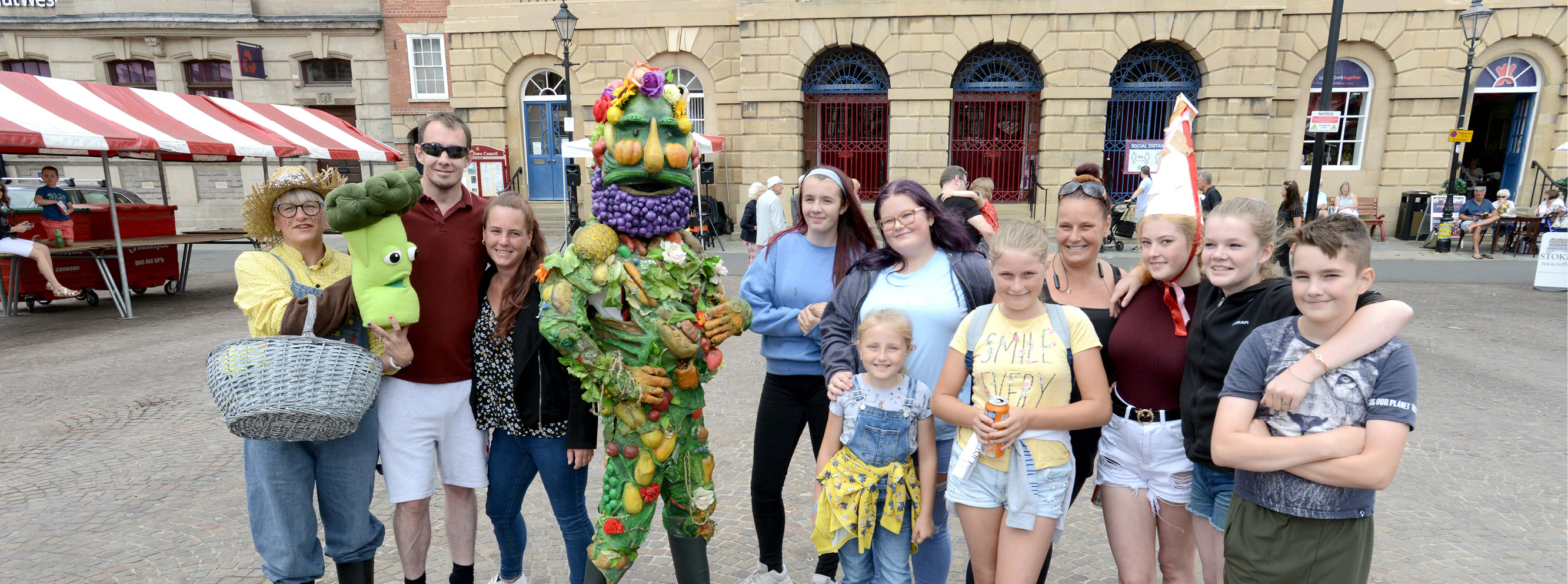 A group of people at Newark Market Place after enjoying a performance as part of our Family Play Day 2021